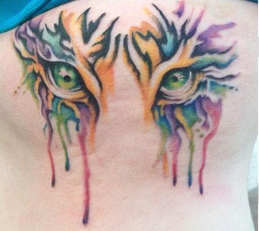 Colorful Watercolor Tiger Eyes Tattoo On Girl Back