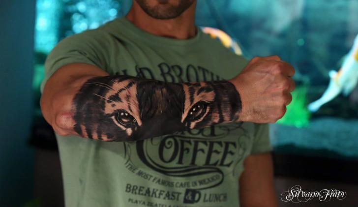 Dark Black Ink Tiger Eyes Tattoo On Outer Forearm By Silvano Fiato