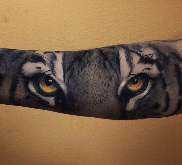 Dark Realistic Tiger Eyes Tattoo On Sleeve