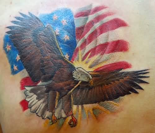 Flying Bald Eagle With American Flag In Background Tattoo Design