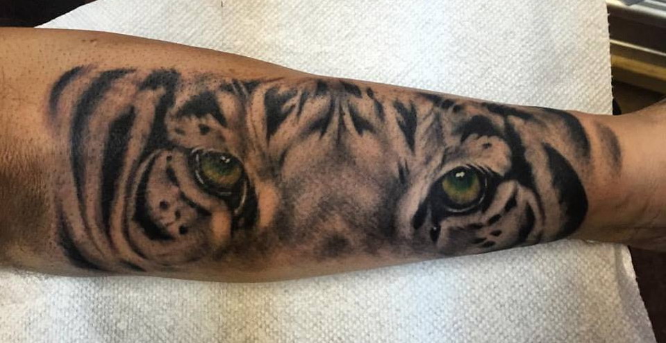 Green Realistic Tiger Eyes Tattoo On Forearm