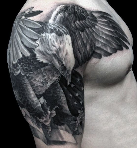 Grey Ink American Flag & Flying Bald Eagle Tattoo On Man Shoulder