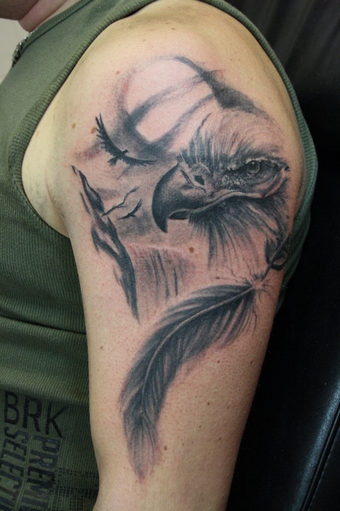 Grey Ink Eagle Head With Feathers, Mountains & Clouds Tattoo On Half Sleeve