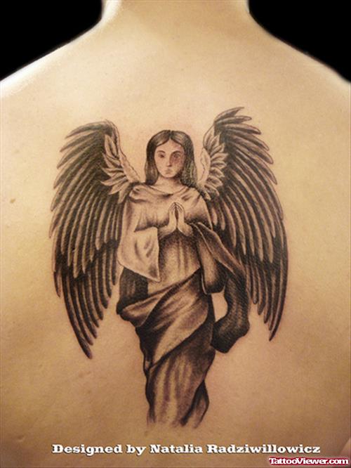 Grey Ink Praying Angel Girl Tattoo Design On Back