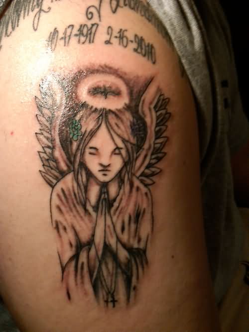 Grey Ink Praying Angel With Halo Tattoo On Half Sleeve.
