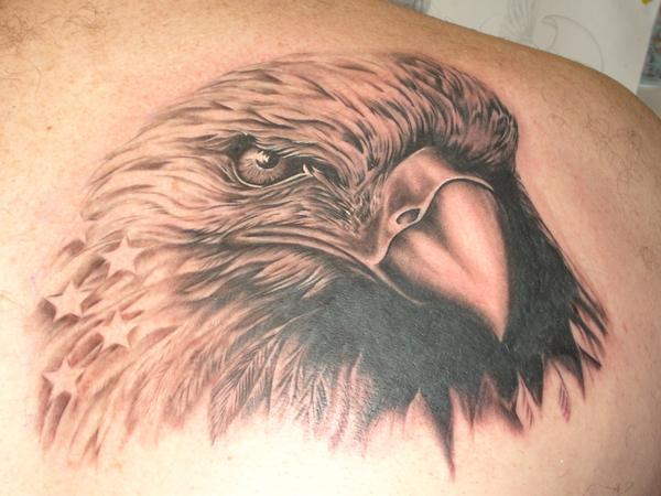 Grey Ink Realistic Eagle Head Tattoo On Back Shoulder