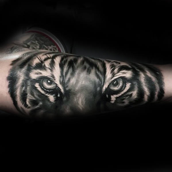Grey Ink Realistic Tiger Eye Tattoo On Forearm 1