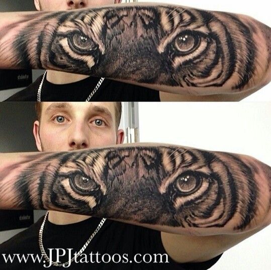 Grey Ink Realistic Tiger Eyes Tattoo On Forearm by JPJ Tattoos