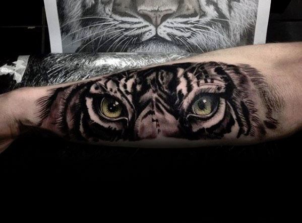 Grey Ink Realistic Tiger Eyes Tattoo On Forearm