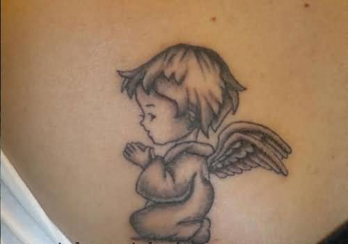 Grey Ink Small Cute Praying Baby Angel Tattoo Design On Back
