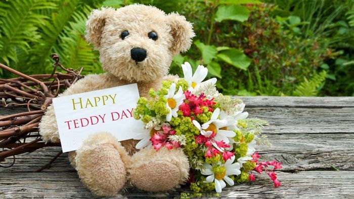 Happy teddy Day card with teddy bear and flowers