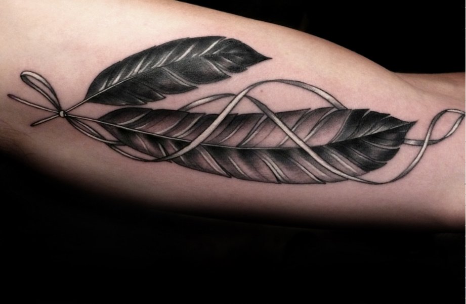 Incredible Grey Ink Eagle Feathers Tattoo On Bicep