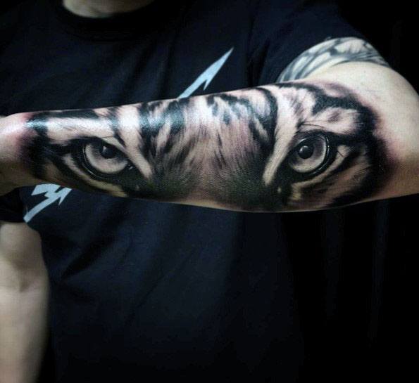 Incredible Grey Ink Tiger Eyes Tattoo On Outer Forearm For Men