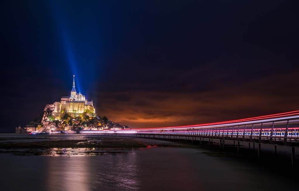 Mont Saint-Michel and bridge at night