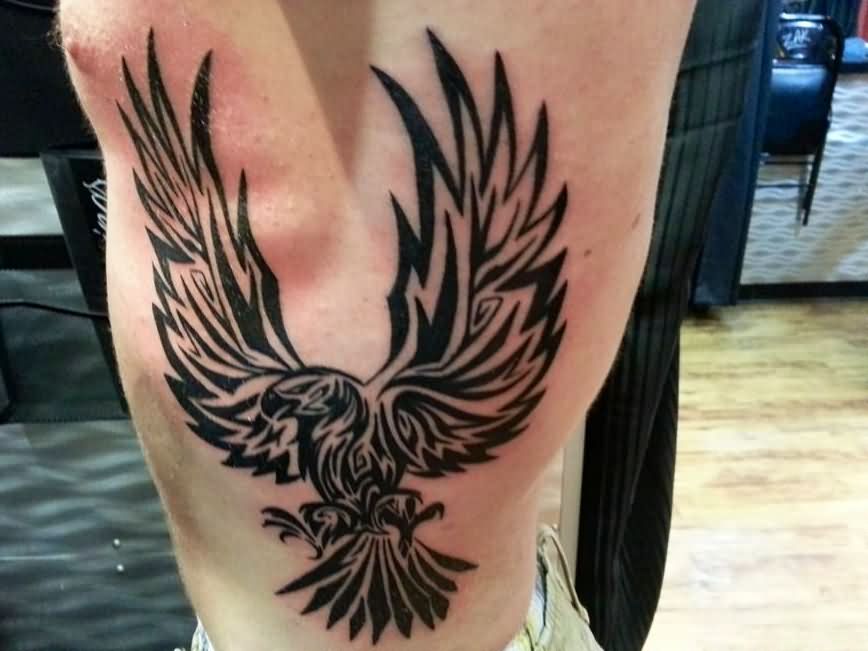 Open Winged Chasing Tribal Eagle Tattoo by Eric Mills at Deja Vu Tattoo Piercing in Winston Salem