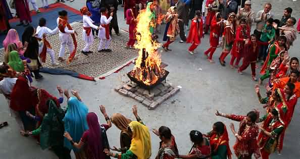 People Dancing Around Bonfire Celebrating Lohri