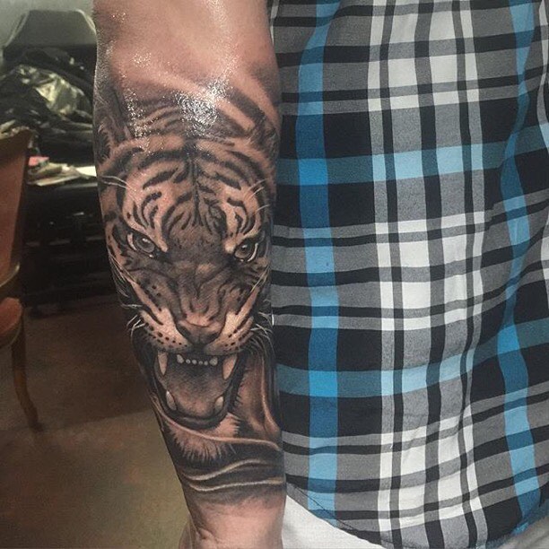 Realistic Angry Roaring Tattoo On Outer Forearm