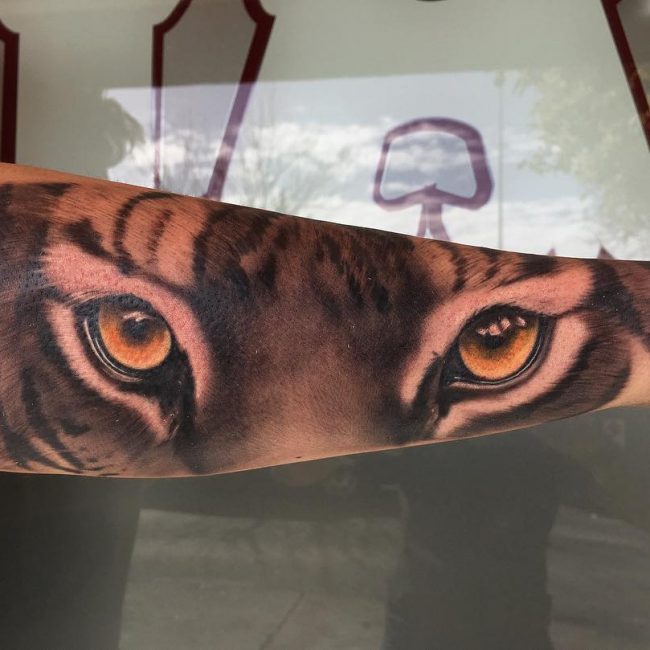 Realistic Tiger Eyes Tattoo On Outer Forearm For Men