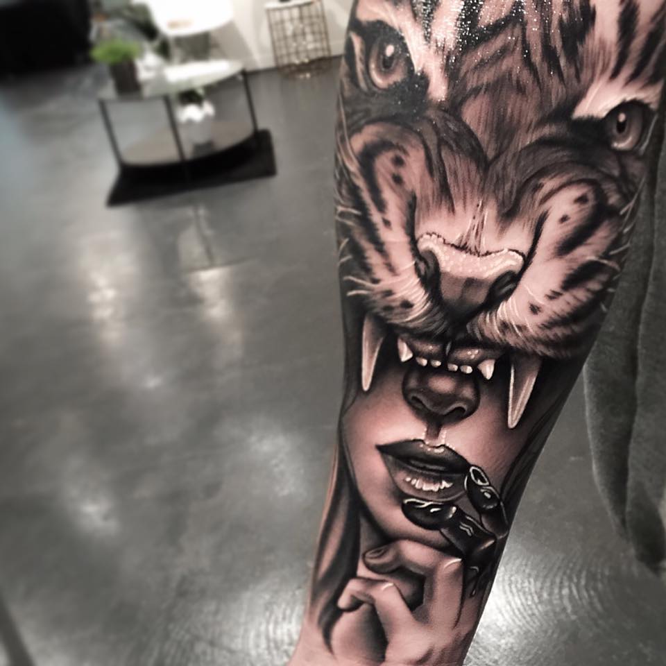 Roaring tiger masked girl tattoo on arm by Levi Barnett
