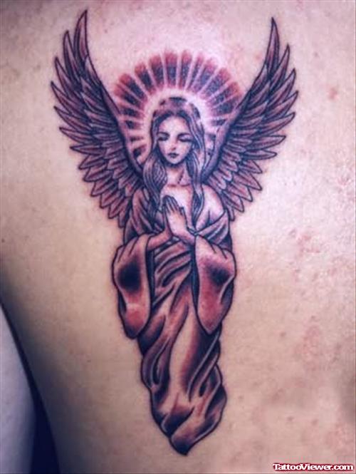 Small Dark Praying Angel Tattoo With Open Wings