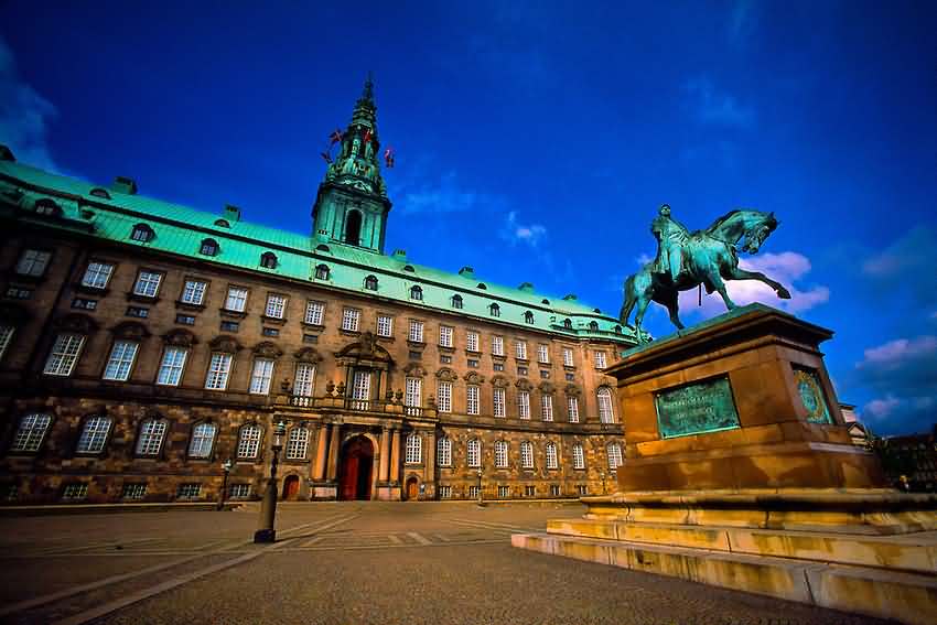 Statue In Front Of The Christiansborg Palace At Dusk