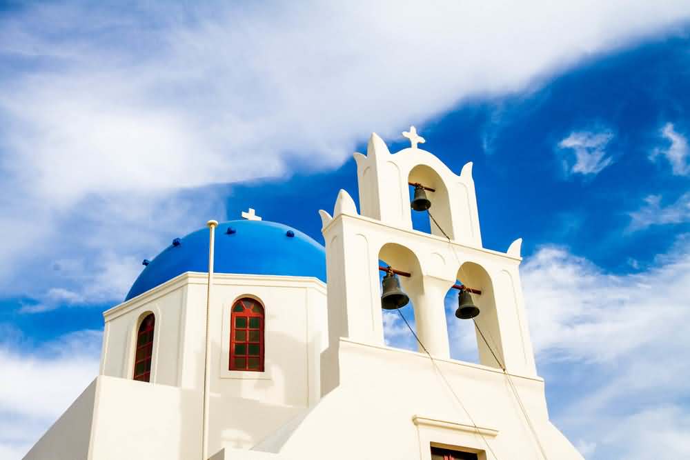 Three Bells And Blue Domes Of Church In Santorini