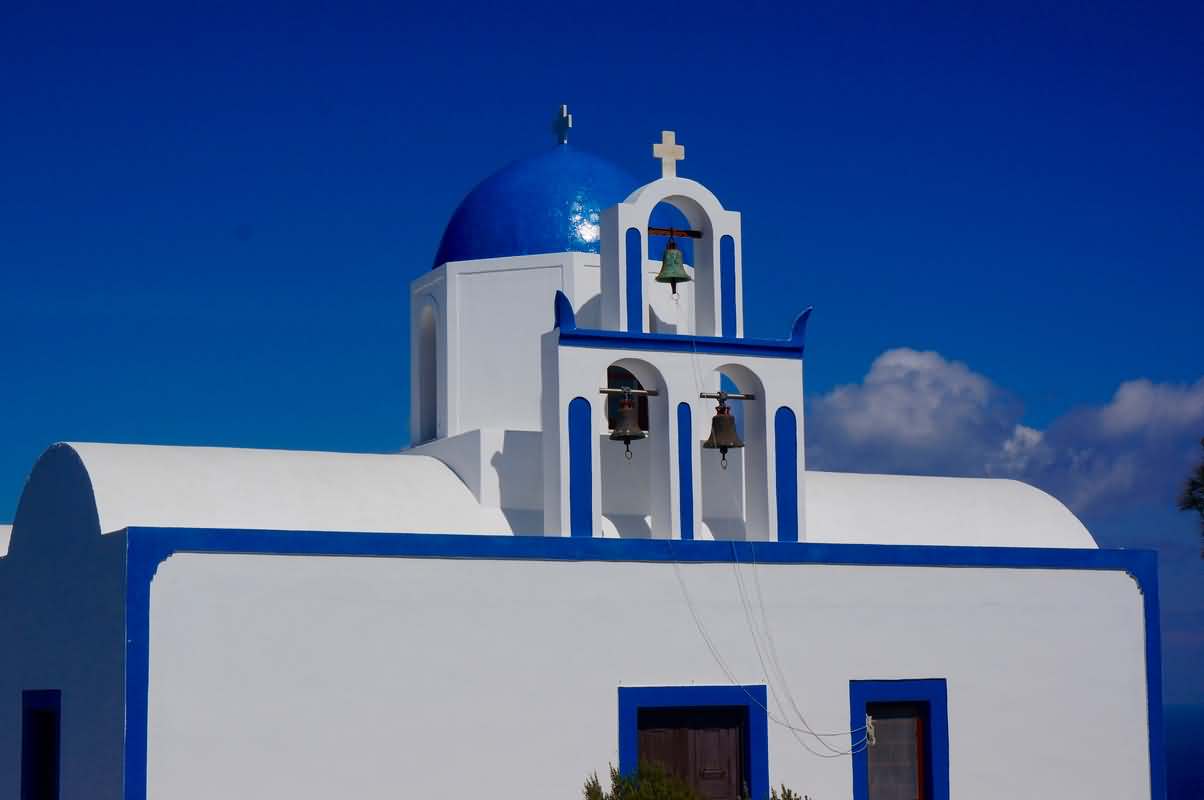 Three Bells Of Blue Domed Church In santorini