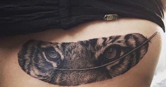 Tiger Eyes In Feather Tattoo On Back