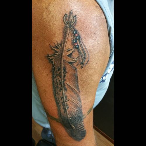 Traditional Tribal Style Eagle Feather Tattoo On Half Sleeve