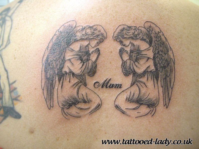 Two Cute Praying Angels Facing Each Other With Word ‘Mom’ Tattoo Design