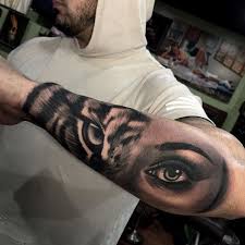 Women & Tiger Eye Composition Tattoo On Man Forearm