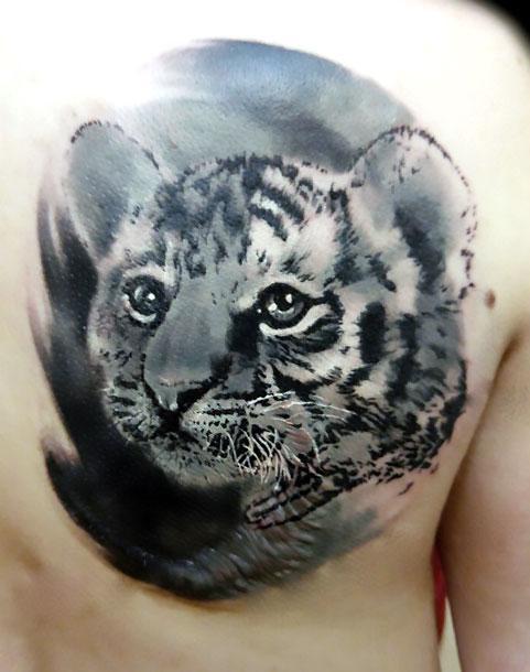 Amazing Black & Grey Ink Baby Tiger Tattoo On Back Shoulder