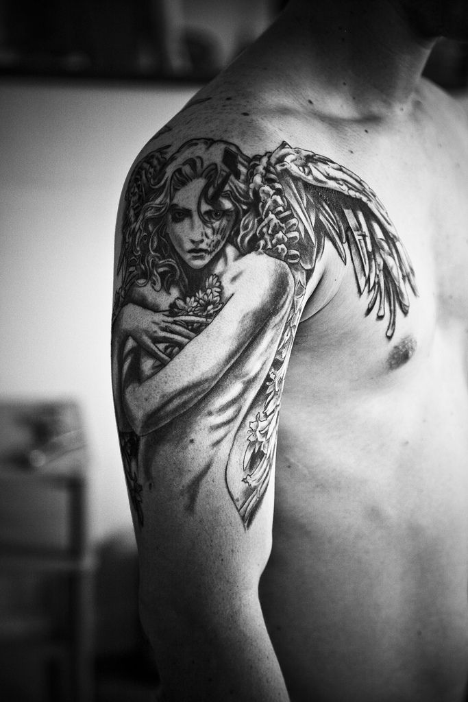 Amazing Black & White Female Guardian Angel Tattoo On Men Shoulder