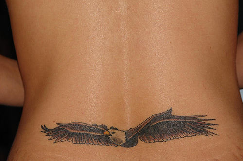 Beautiful Flying Bald Eagle Tattoo On Lower Back For Girls