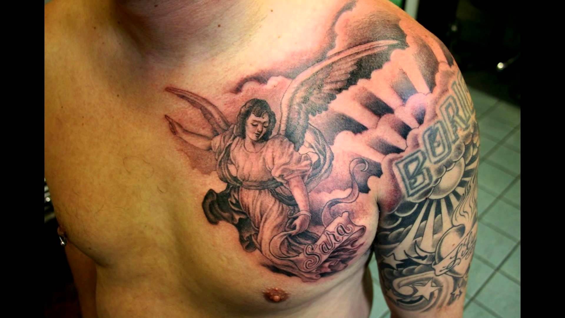 Black And Grey Ink Guardian Angel Tattoo On Chest For Men