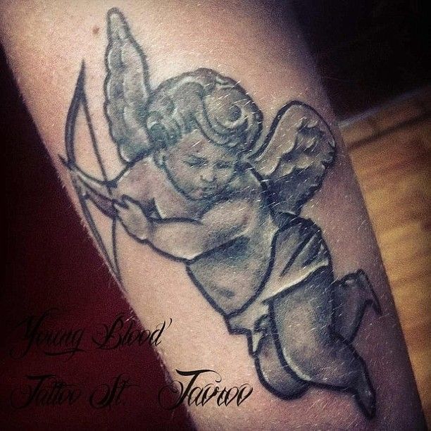 Black Grey Flying Cupid Cherub Tattoo On Arm