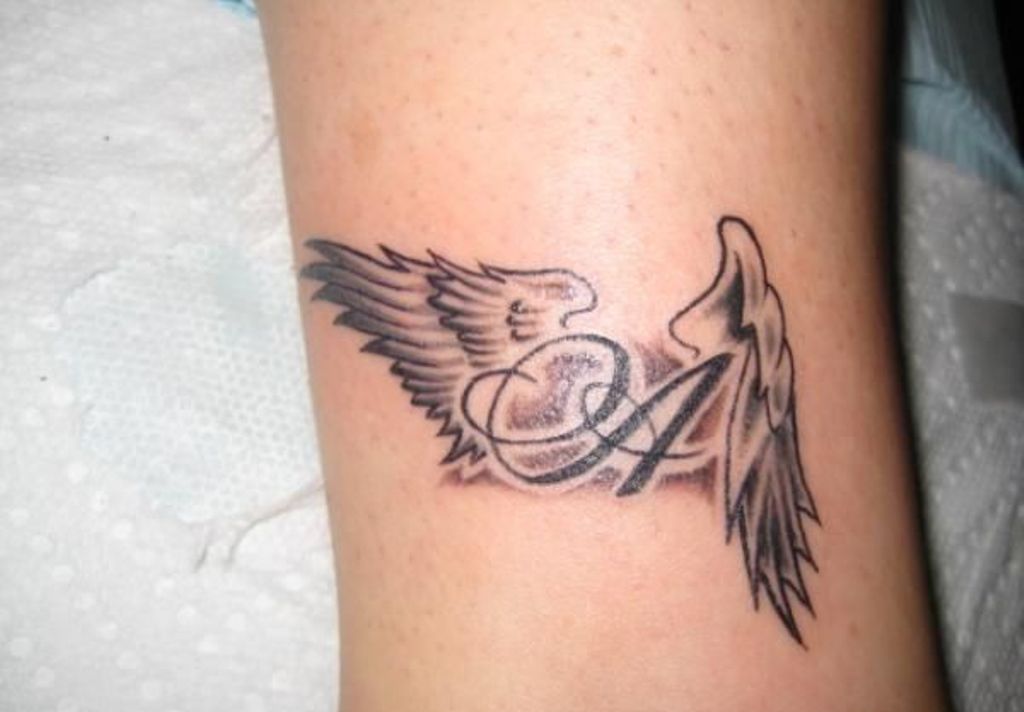 Black & Grey Ink Angel Wings With Letter A Tattoo Design