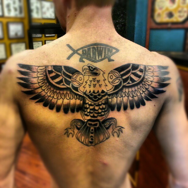 Black Ink Haida Eagle Tattoo On Back For Men