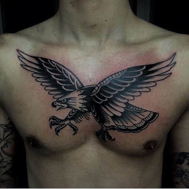 Black Ink Traditional Flying Eagle Tattoo On Male Chest