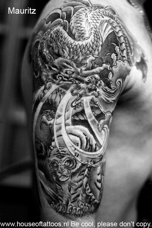 45+ Dragon And Tiger Tattoos & Designs With Meanings