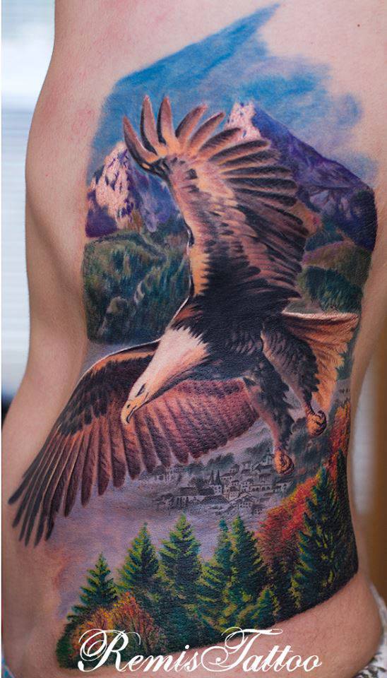 Colorful Realistic Bald Eagle With Scenery Tattoo On Siderib & Back By Remis Tattoo