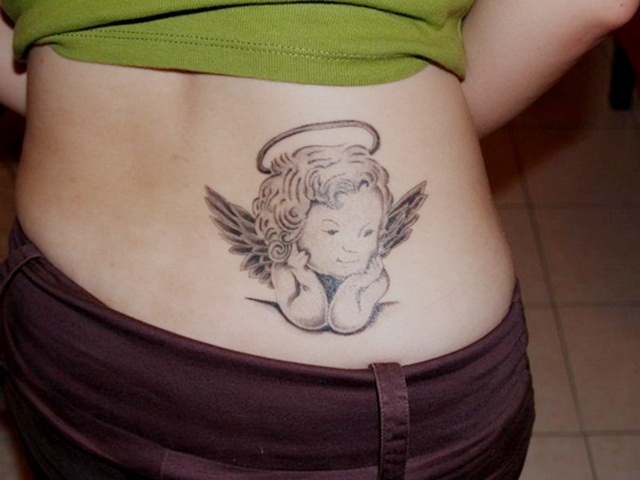 Cute Grey Ink Baby Angel With Halo Tattoo Design On Girl Lower Back