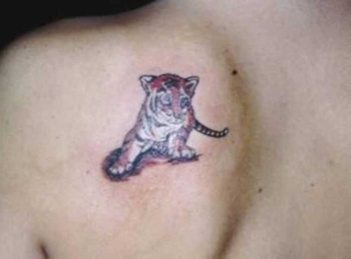 Cute Small Baby Tiger Tattoo On Girl Back Shoulder
