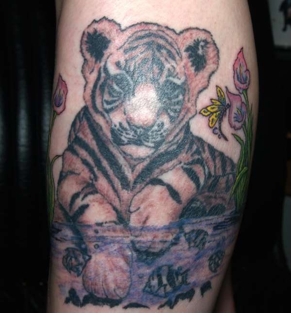 Grey Ink Baby Tiger With Flowers Tattoo On Arm