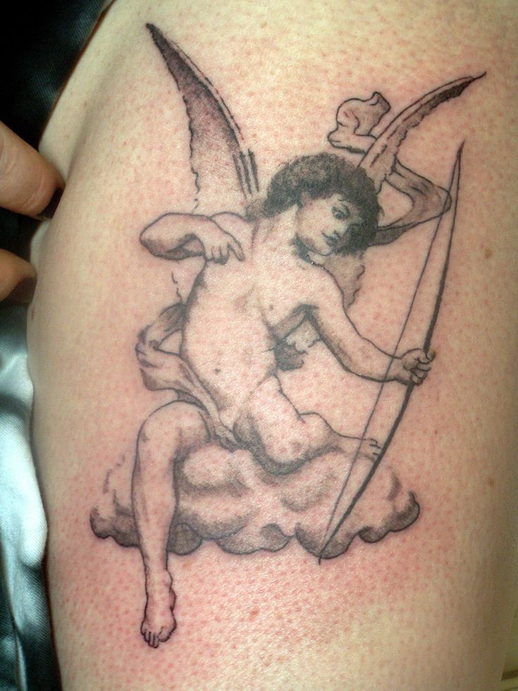 Grey Ink Cupid Cherub Tattoo On Thigh