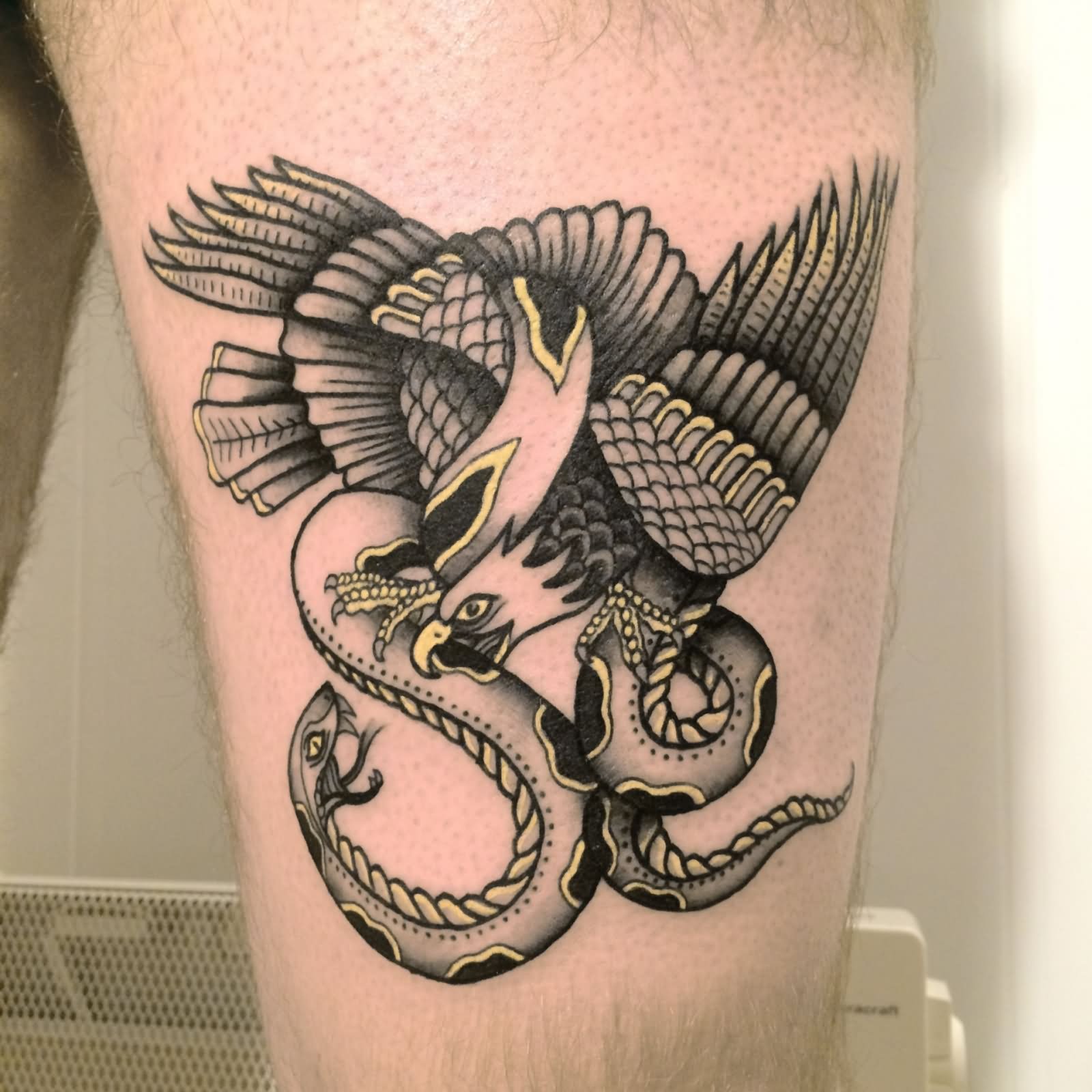 Grey Ink Eagle & Snake Tattoo With Yellow Outline On Thigh