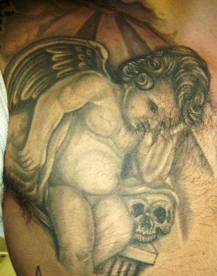 Sad Cherub And Skull Tattoo