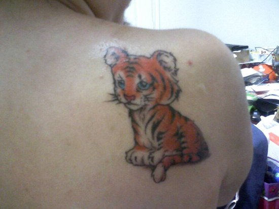 Small Cute Girly Baby Tiger Tattoo On Girl Back Shoulder