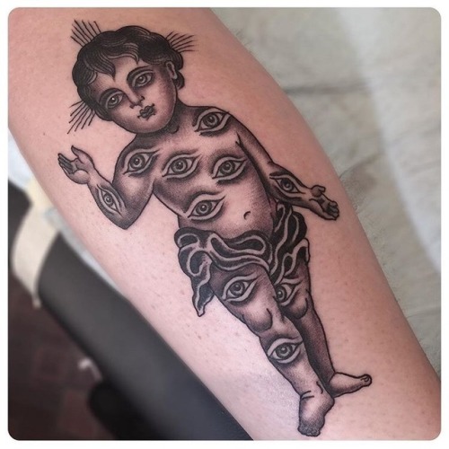 Unique Black Ink Cherub Tattoo On Forearm