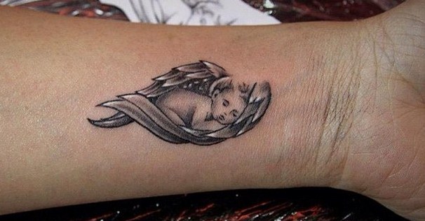 Wonderful Baby Angel Sleeping In Wings Tattoo On Wrist